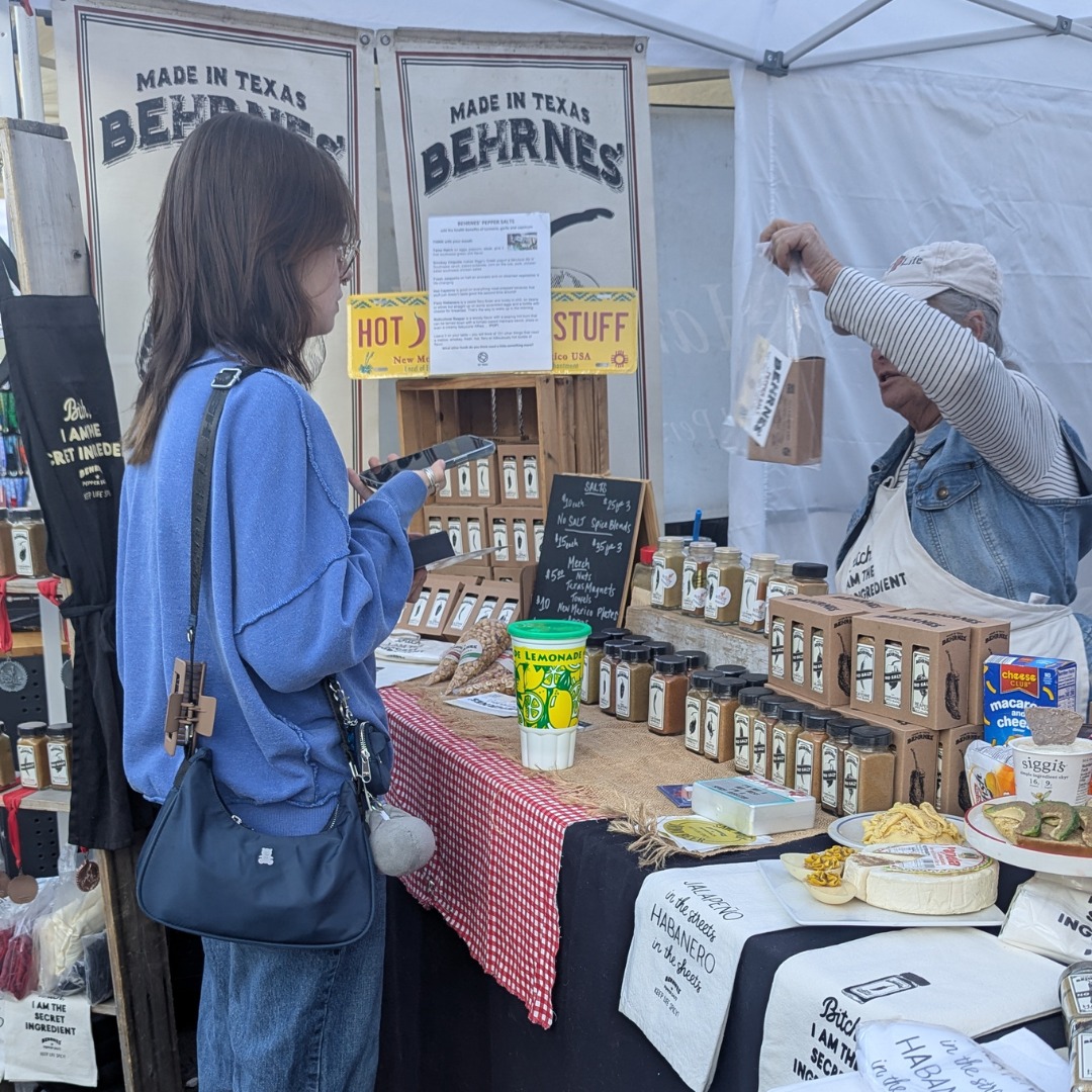 Behrnes Pepper Salts: A customer shops the flavors at McKinney Farmers Market.